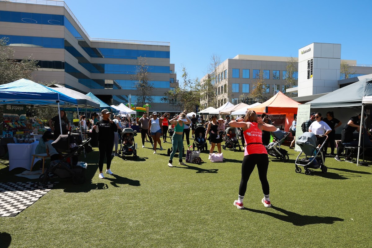 FIT4MOM Grand Reopening at Hangar 24 with vendors, fitness class, and families